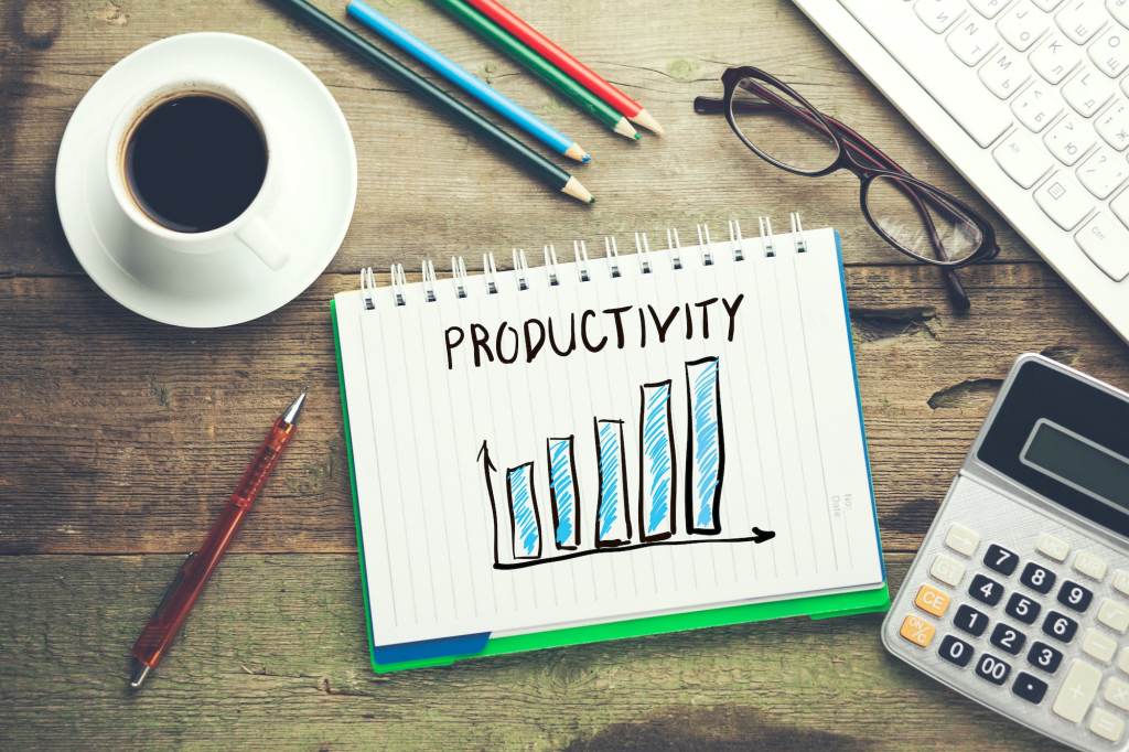 productivity text on notepad with keyboard on table