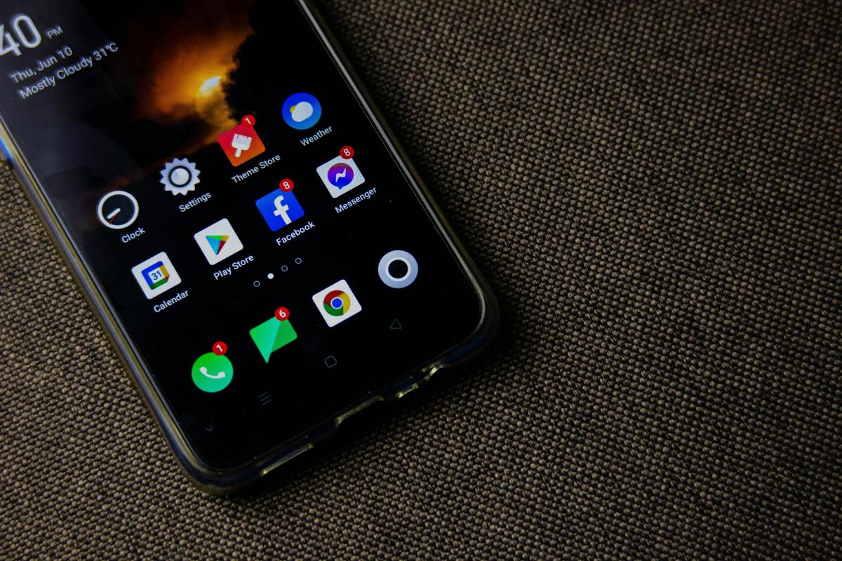 Close-up of a smartphone on a simple brown surface, representing mindful phone use and digital minimalism.